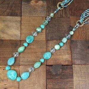 Long turquoise color bead necklace with acrylic, seed beads, and silver beads
